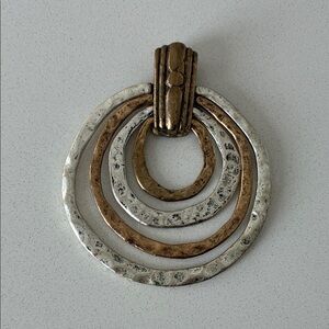 large brass and silver pendant